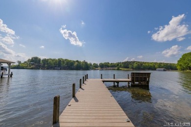 Enjoy main lake views and water-access living from this cape cod on Tanglewood Shores Golf Club in Virginia - for sale on GolfHomes.com, golf home, golf lot