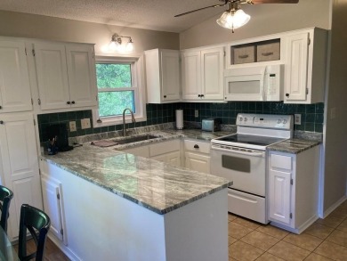 ABSOLUTELY STUNNING! MOVE-IN READY with STORAGE GALORE! on Cherokee Village North Course in Arkansas - for sale on GolfHomes.com, golf home, golf lot