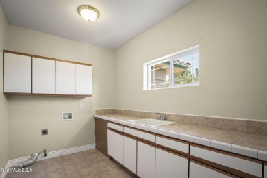 This custom built 4 bed / 4 bath home is nestled at the end of a on Wolf Run Golf Club in Nevada - for sale on GolfHomes.com, golf home, golf lot