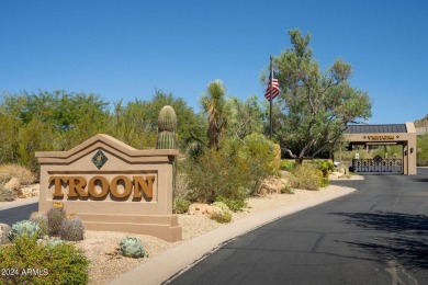 Resort-style living with sweeping Pinnacle Peak, sunset & city on Troon Country Club in Arizona - for sale on GolfHomes.com, golf home, golf lot