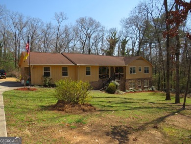 Sprawling brick ranch over full basement located in great area on Cherokee Golf and Country Club in Georgia - for sale on GolfHomes.com, golf home, golf lot