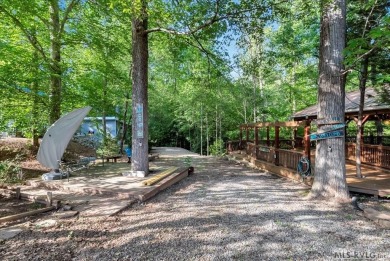 Lake life made easy--and fun! This Lake Gaston camper sits on a on River Ridge Golf Club in Virginia - for sale on GolfHomes.com, golf home, golf lot