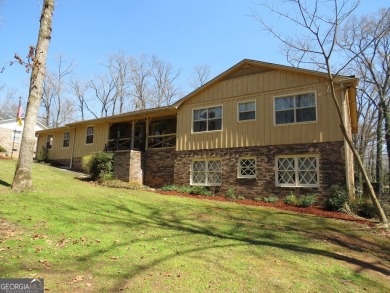 Sprawling brick ranch over full basement located in great area on Cherokee Golf and Country Club in Georgia - for sale on GolfHomes.com, golf home, golf lot