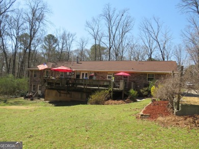 Sprawling brick ranch over full basement located in great area on Cherokee Golf and Country Club in Georgia - for sale on GolfHomes.com, golf home, golf lot