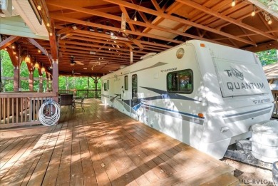 Lake life made easy--and fun! This Lake Gaston camper sits on a on River Ridge Golf Club in Virginia - for sale on GolfHomes.com, golf home, golf lot