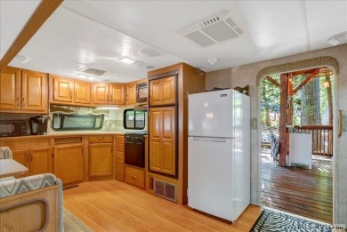 Lake life made easy--and fun! This Lake Gaston camper sits on a on River Ridge Golf Club in Virginia - for sale on GolfHomes.com, golf home, golf lot