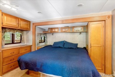 Lake life made easy--and fun! This Lake Gaston camper sits on a on River Ridge Golf Club in Virginia - for sale on GolfHomes.com, golf home, golf lot