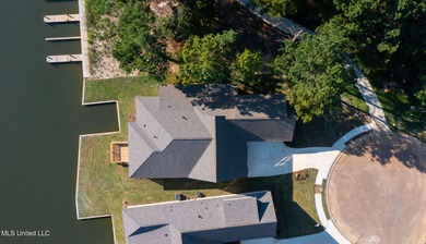 EXPERIENCE WATERFRONT LIVING AT ITS FINEST IN BEAUTIFUL LAKE on Lake Caroline Golf Club in Mississippi - for sale on GolfHomes.com, golf home, golf lot
