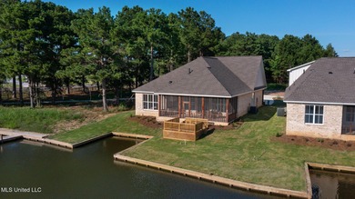 EXPERIENCE WATERFRONT LIVING AT ITS FINEST IN BEAUTIFUL LAKE on Lake Caroline Golf Club in Mississippi - for sale on GolfHomes.com, golf home, golf lot