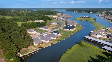 EXPERIENCE WATERFRONT LIVING AT ITS FINEST IN BEAUTIFUL LAKE on Lake Caroline Golf Club in Mississippi - for sale on GolfHomes.com, golf home, golf lot