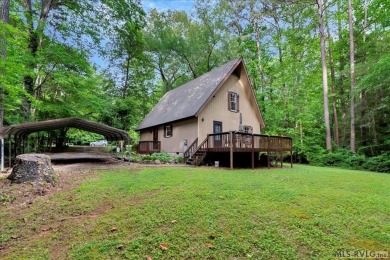 Cute A-frame tucked in the woods at the end of a cul-de-sac on Tanglewood Shores Golf Club in Virginia - for sale on GolfHomes.com, golf home, golf lot