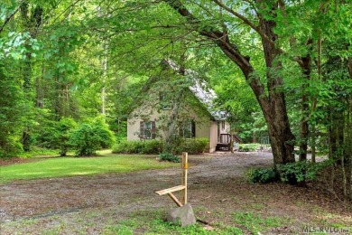 Cute A-frame tucked in the woods at the end of a cul-de-sac on Tanglewood Shores Golf Club in Virginia - for sale on GolfHomes.com, golf home, golf lot