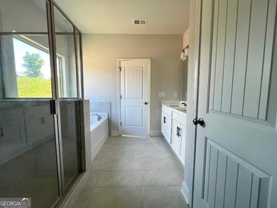 The Ellington Plan built by Stephen Elliott Homes. Quick on Chimney Oaks Golf Club in Georgia - for sale on GolfHomes.com, golf home, golf lot