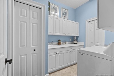 A true golfer's paradise, perfectly positioned on the 5th hole on PGA Golf Club in PGA Village in Florida - for sale on GolfHomes.com, golf home, golf lot