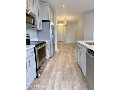 Welcome to Unit 126, a beautifully appointed second-level corner on Gulf Hills Golf Club in Mississippi - for sale on GolfHomes.com, golf home, golf lot