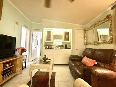 This charming 2BR/2BA home in Barefoot bay, combines comfortable on Barefoot Bay Golf Course in Florida - for sale on GolfHomes.com, golf home, golf lot