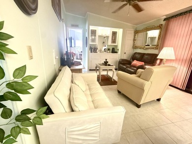 This charming 2BR/2BA home in Barefoot bay, combines comfortable on Barefoot Bay Golf Course in Florida - for sale on GolfHomes.com, golf home, golf lot