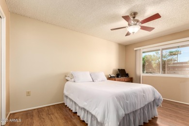 Nestled on a charming tree-lined street, this home offers on Sun City Lakes West and East in Arizona - for sale on GolfHomes.com, golf home, golf lot