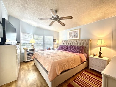 This charming 2BR/2BA home in Barefoot bay, combines comfortable on Barefoot Bay Golf Course in Florida - for sale on GolfHomes.com, golf home, golf lot