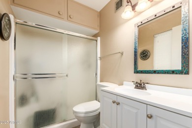 Nestled on a charming tree-lined street, this home offers on Sun City Lakes West and East in Arizona - for sale on GolfHomes.com, golf home, golf lot