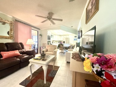 This charming 2BR/2BA home in Barefoot bay, combines comfortable on Barefoot Bay Golf Course in Florida - for sale on GolfHomes.com, golf home, golf lot