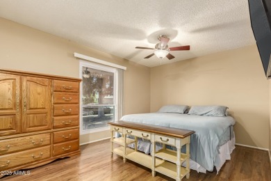 Nestled on a charming tree-lined street, this home offers on Sun City Lakes West and East in Arizona - for sale on GolfHomes.com, golf home, golf lot