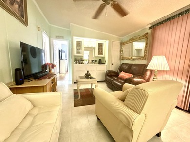 This charming 2BR/2BA home in Barefoot bay, combines comfortable on Barefoot Bay Golf Course in Florida - for sale on GolfHomes.com, golf home, golf lot