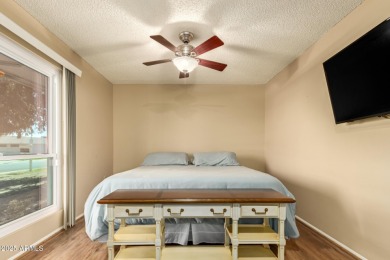 Nestled on a charming tree-lined street, this home offers on Sun City Lakes West and East in Arizona - for sale on GolfHomes.com, golf home, golf lot