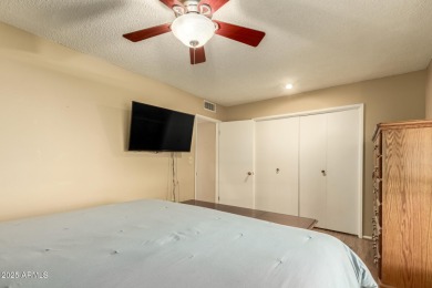 Nestled on a charming tree-lined street, this home offers on Sun City Lakes West and East in Arizona - for sale on GolfHomes.com, golf home, golf lot