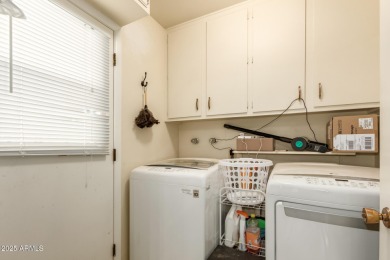 Nestled on a charming tree-lined street, this home offers on Sun City Lakes West and East in Arizona - for sale on GolfHomes.com, golf home, golf lot