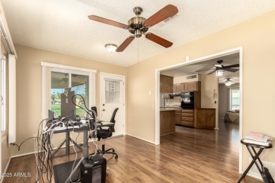 Nestled on a charming tree-lined street, this home offers on Sun City Lakes West and East in Arizona - for sale on GolfHomes.com, golf home, golf lot