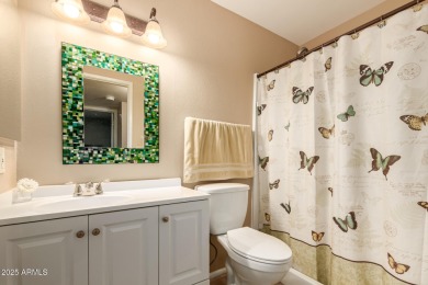 Nestled on a charming tree-lined street, this home offers on Sun City Lakes West and East in Arizona - for sale on GolfHomes.com, golf home, golf lot