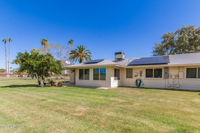 Nestled on a charming tree-lined street, this home offers on Sun City Lakes West and East in Arizona - for sale on GolfHomes.com, golf home, golf lot