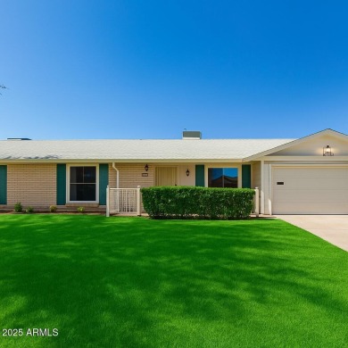 Nestled on a charming tree-lined street, this home offers on Sun City Lakes West and East in Arizona - for sale on GolfHomes.com, golf home, golf lot