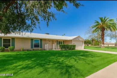 Nestled on a charming tree-lined street, this home offers on Sun City Lakes West and East in Arizona - for sale on GolfHomes.com, golf home, golf lot