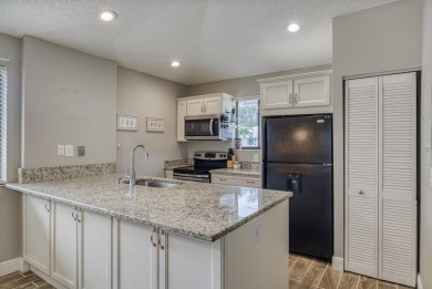 Discover this beautifully updated 2-bedroom, 2-bathroom home in on PGA National Golf Club in Florida - for sale on GolfHomes.com, golf home, golf lot