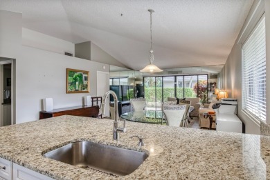 Discover this beautifully updated 2-bedroom, 2-bathroom home in on PGA National Golf Club in Florida - for sale on GolfHomes.com, golf home, golf lot