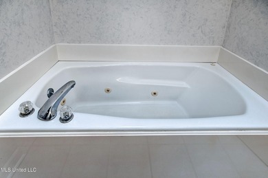 Charming home. Great location! 3 bedroom 2.5 bath home with on Castlewoods Golf Club in Mississippi - for sale on GolfHomes.com, golf home, golf lot