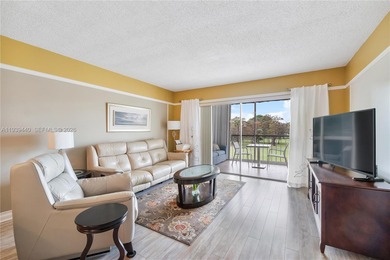 Beautifully furnished unit in 55+ community overlooking the golf on Oriole Golf and Tennis Club in Florida - for sale on GolfHomes.com, golf home, golf lot