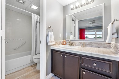 Beautifully furnished unit in 55+ community overlooking the golf on Oriole Golf and Tennis Club in Florida - for sale on GolfHomes.com, golf home, golf lot