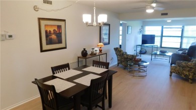 This second floor unit has upgraded luxury vinyl flooring on Vista Plantation Golf Club in Florida - for sale on GolfHomes.com, golf home, golf lot