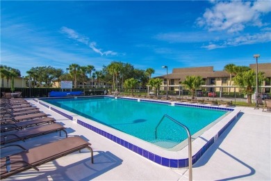 This second floor unit has upgraded luxury vinyl flooring on Vista Plantation Golf Club in Florida - for sale on GolfHomes.com, golf home, golf lot