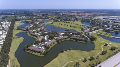 This second floor unit has upgraded luxury vinyl flooring on Vista Plantation Golf Club in Florida - for sale on GolfHomes.com, golf home, golf lot