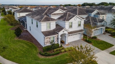 This stunning corner lot home is truly a gem - perfect for a on The Oasis Club at Champions Gate in Florida - for sale on GolfHomes.com, golf home, golf lot