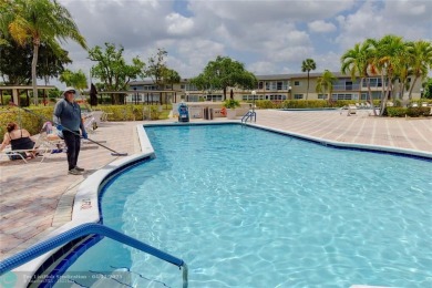 Beautifully Renovated 2-Bed, 2-Bath Corner Condo with th Golf on Oriole Golf and Tennis Club in Florida - for sale on GolfHomes.com, golf home, golf lot