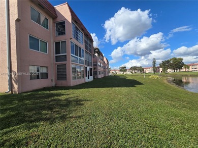 Spacious 1-bedroom, 1.5-bath first-floor condo offering serene on Sunrise Lakes Phase III in Florida - for sale on GolfHomes.com, golf home, golf lot