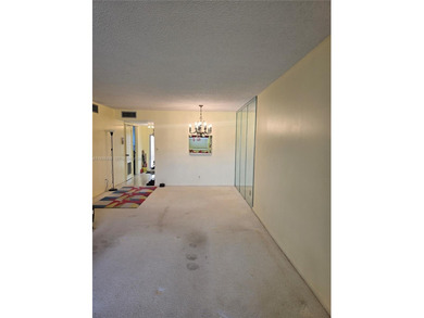 Spacious 1-bedroom, 1.5-bath first-floor condo offering serene on Sunrise Lakes Phase III in Florida - for sale on GolfHomes.com, golf home, golf lot