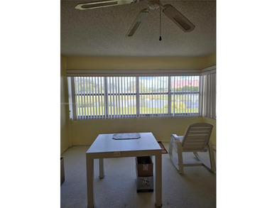 Spacious 1-bedroom, 1.5-bath first-floor condo offering serene on Sunrise Lakes Phase III in Florida - for sale on GolfHomes.com, golf home, golf lot