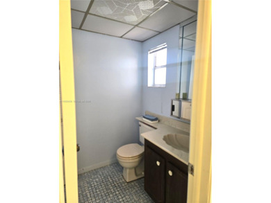 Spacious 1-bedroom, 1.5-bath first-floor condo offering serene on Sunrise Lakes Phase III in Florida - for sale on GolfHomes.com, golf home, golf lot