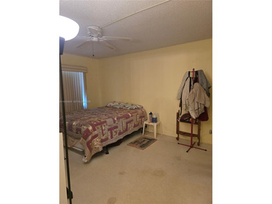 Spacious 1-bedroom, 1.5-bath first-floor condo offering serene on Sunrise Lakes Phase III in Florida - for sale on GolfHomes.com, golf home, golf lot